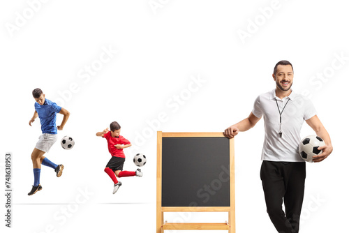 Football players at training and coach leaning on a blackboard © Ljupco Smokovski