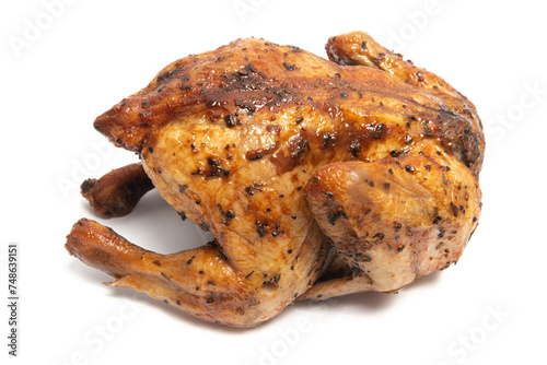 A whole delicious roasted chicken seasoned with herbs isolated on white background clipping path