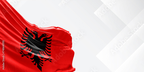 Albania national flag cloth fabric waving on beautiful white Background.