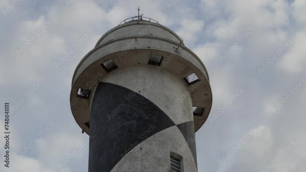 Faro Albardao lighthouse tower along a white sand beach at the coast of the atlantic ocean in southern Brazil serves for navigational purposes and is used as military base. Faro Albardao lighthouse tower along a white sand beach at the coast of the atlantic ocean in southern Brazil serves for navigational purposes and is used as military base.