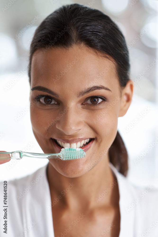 Woman, brushing teeth and toothbrush for dental, portrait with smile in bathroom for morning routine. Oral hygiene, wellness and orthodontics with toothpaste for fresh breath, health and self care Woman, brushing teeth and toothbrush for dental, portrait with smile in bathroom for morning routine. Oral hygiene, wellness and orthodontics with toothpaste for fresh breath, health and self care