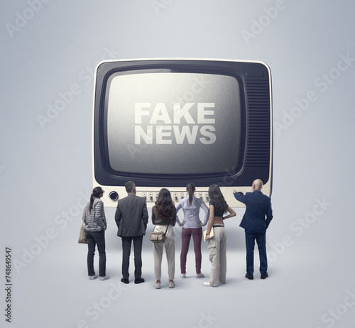 Audience following fake news on television © stokkete
