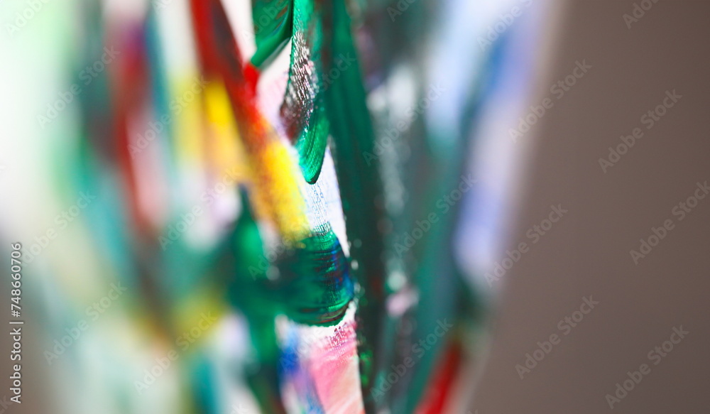 Close-up view of oil paint brush strokes. Macro shot of mixed colours on canvas. Fragment of painting. Modern artwork and creative masterpiece. Art and hobby concept