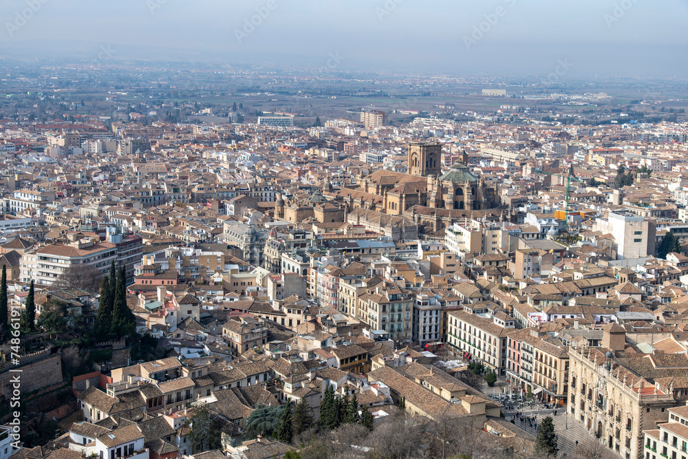 High level panoramic view over the city of Granada, Spain seen from the Alhambra palace with in the middle the Cathedral of Granada (Catedral de Granada) and Plaza Nueva de Granada