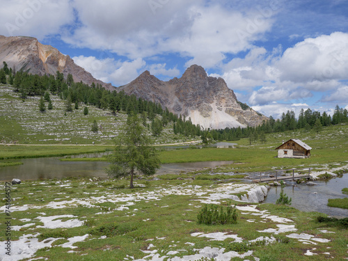 Le Vert Lake near the Lavarella Hut in the Greenery of the Fanes - Sennes - Braies Nature Park, Alpi Mountains, Italy photo