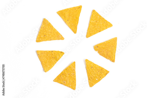 Crispy corn tortilla nachos chips photo concept of circle formation isolated on white background clipping path