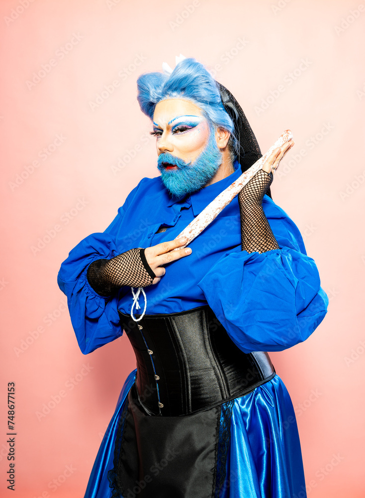 Flamboyant Drag Queen in Blue Attire Holding a Salami Sausage