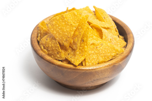 Crispy corn tortilla nachos chips in a wooden bowl isolated on white background clipping path
