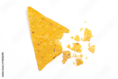 Crashed of crispy corn tortilla nachos chips with crumble isolated on white background clipping path