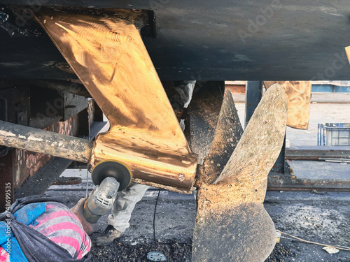 Slika na platnu A boat in dry dock for repair