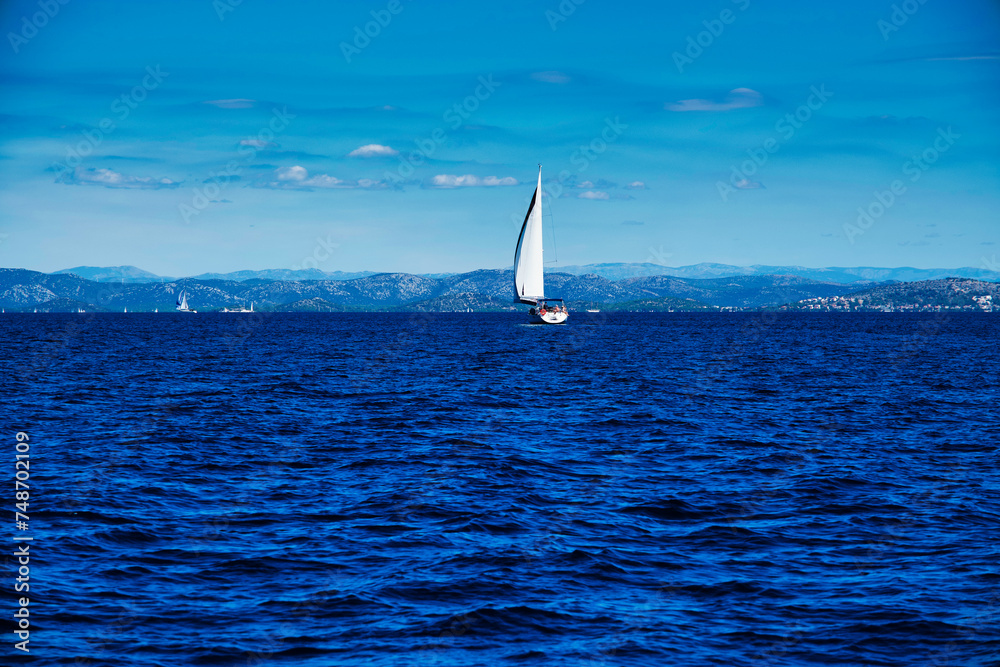 The White Sailing Boat is cruising the Adriatic Sea in Rogoznica Croatia.