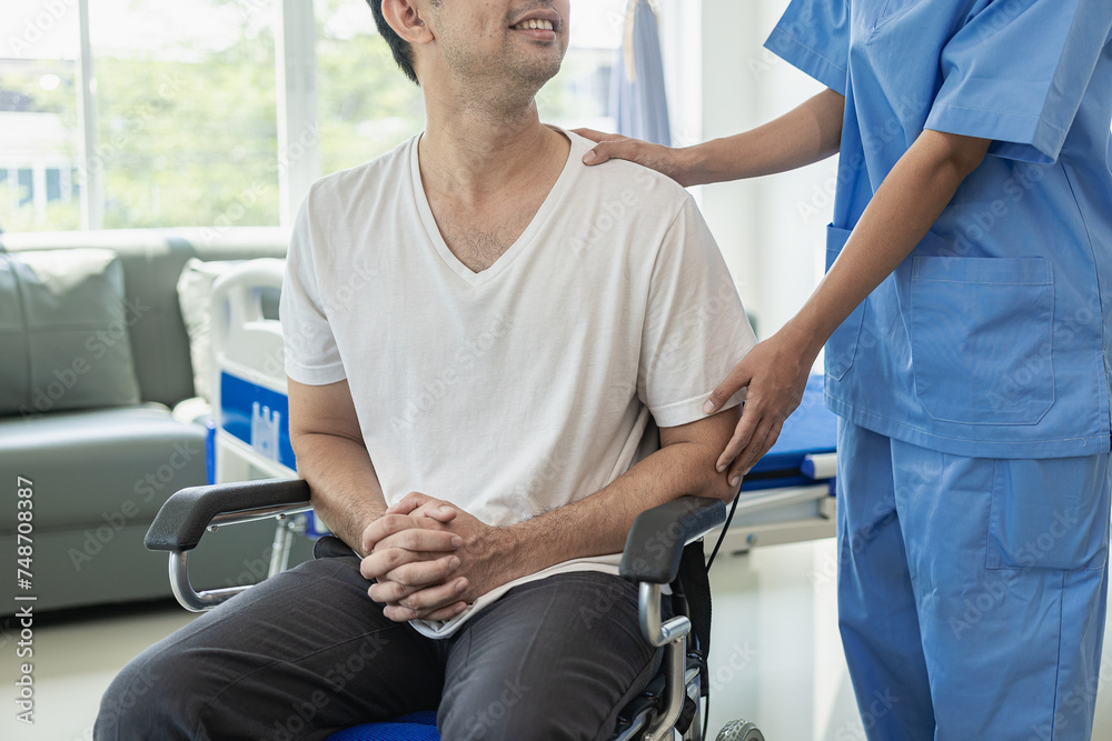 Obraz premium An Asian male patient lies in a hospital bed and receives good care from a doctor. Doctor giving advice to male patient working on health diagnosis