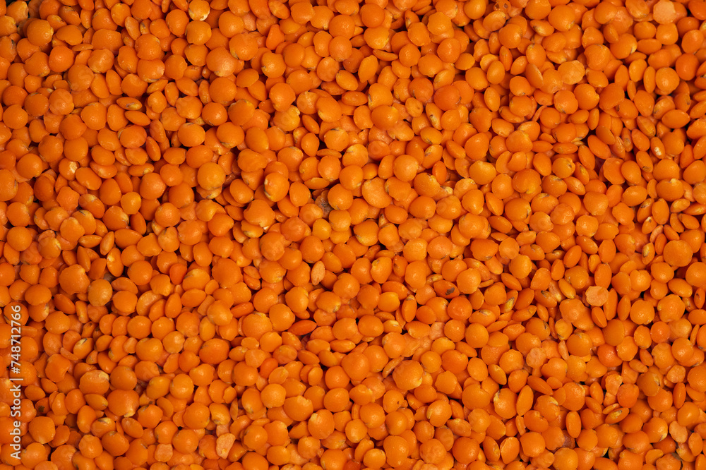 Red lentils background or texture. Closeup, top view Red lentils background or texture. Closeup, top view