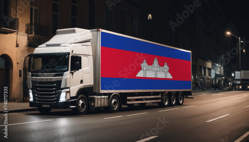 A truck with the national flag of Cambodia depicted carries goods to another country along the highway. Concept of export-import,transportation, national delivery of goods.
