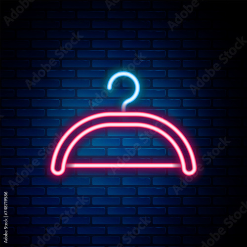 Glowing neon line Hanger wardrobe icon isolated on brick wall background. Cloakroom icon. Clothes service symbol. Laundry hanger sign. Colorful outline concept. Vector