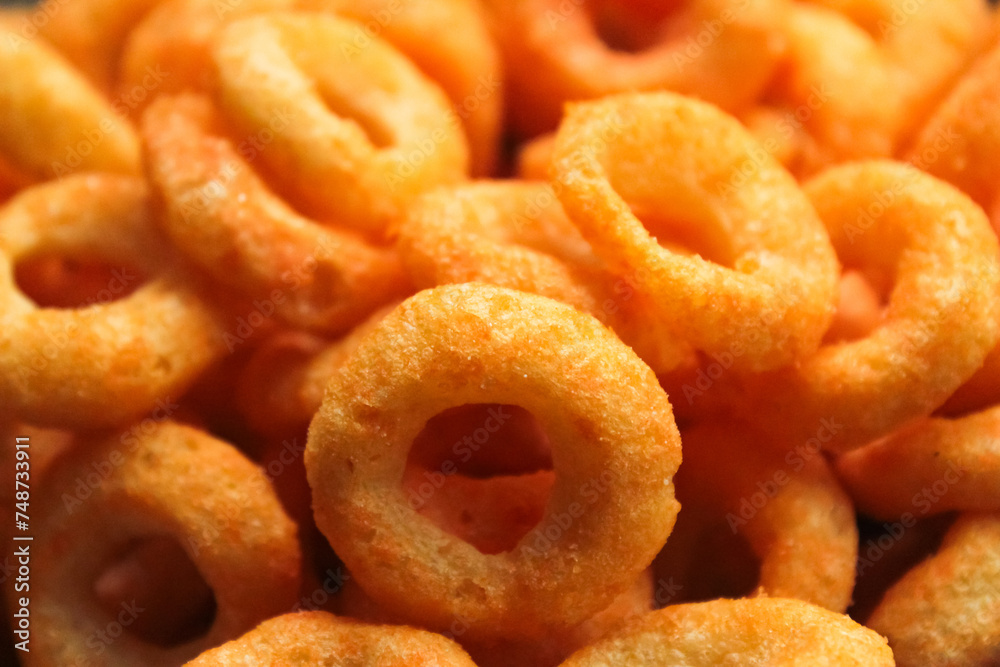  pile of crunchy cheese-flavored ring snacks