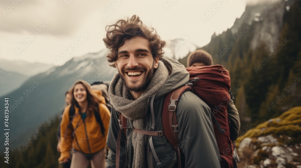 A group of Happy Smiling Friends with a backpack on a hike in the mountains. Hiking, Active tourism, Nature, Summer, Travel, Lifestyle concepts. The horizontal photo.