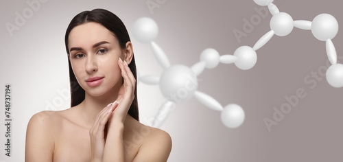 Beautiful woman with perfect healthy skin and molecular model on grey background, banner design. Innovative cosmetology photo