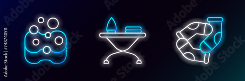 Set line Socks, Sponge and Iron and ironing board icon. Glowing neon. Vector