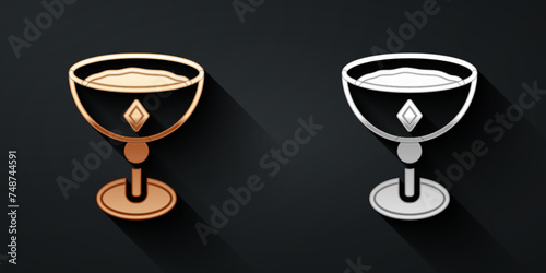 Gold and silver Medieval goblet icon isolated on black background. Long shadow style. Vector