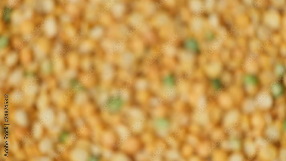 Raw split yellow peas macro slow motion top view Raw split yellow peas macro slow motion top view
