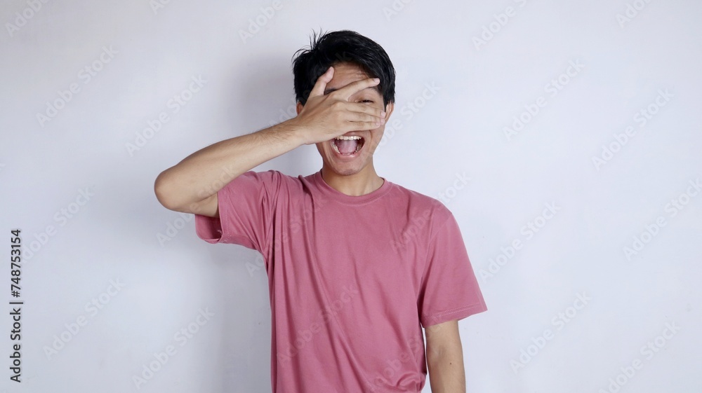 shocked Asian man closing his eyes but still able to see shocked Asian man closing his eyes but still able to see
