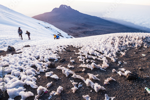 Stella Point Ascent: Embracing Dawn with Mawenzi in Sight photo