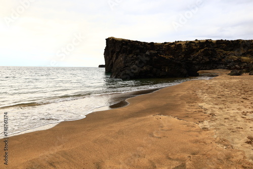 Skarðsvík is a tiny and charming beach with huge basaltic rock formations and a golden sandy beach located in the Snæfellsjökull National Park