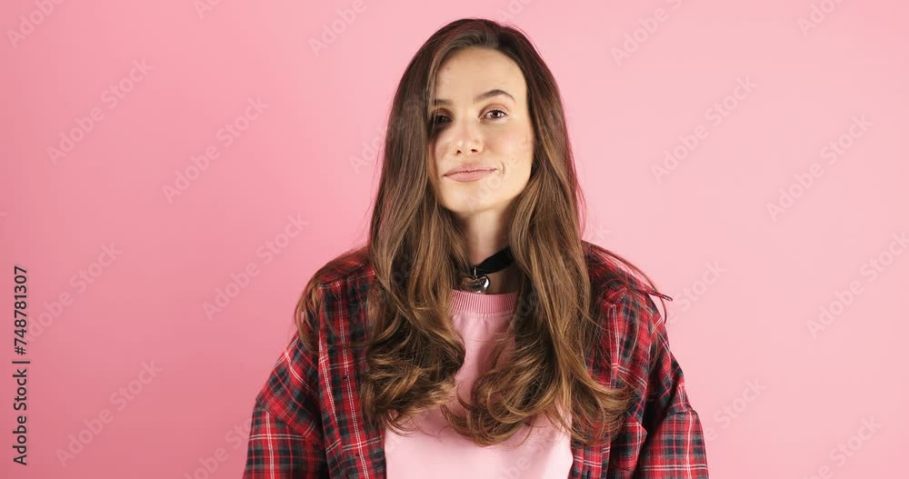Bye woman. Portrait of brunette woman make bye gesture. Female model waving bye hand, spread hands. Female person say good bye and wear red plaid shirt, standing on pink background. Bye woman. Portrait of brunette woman make bye gesture. Female model waving bye hand, spread hands. Female person say good bye and wear red plaid shirt, standing on pink background.