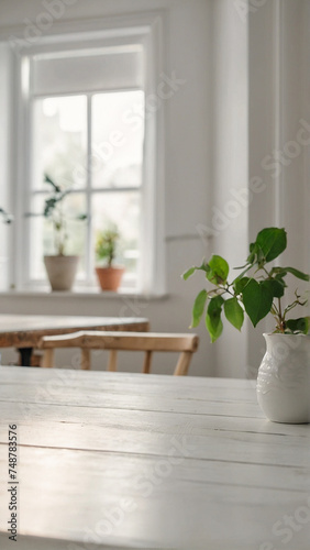 empty white wooden table for product display, blurred minimalist home dining room interior background with white scandinavian style table and chairs with garden view through window 