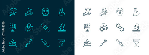 Set line Rabbit with ears, Magic wand, Bow tie, Dagger, Handcuffs, Skull, Ball levitating above hand and holding fire icon. Vector
