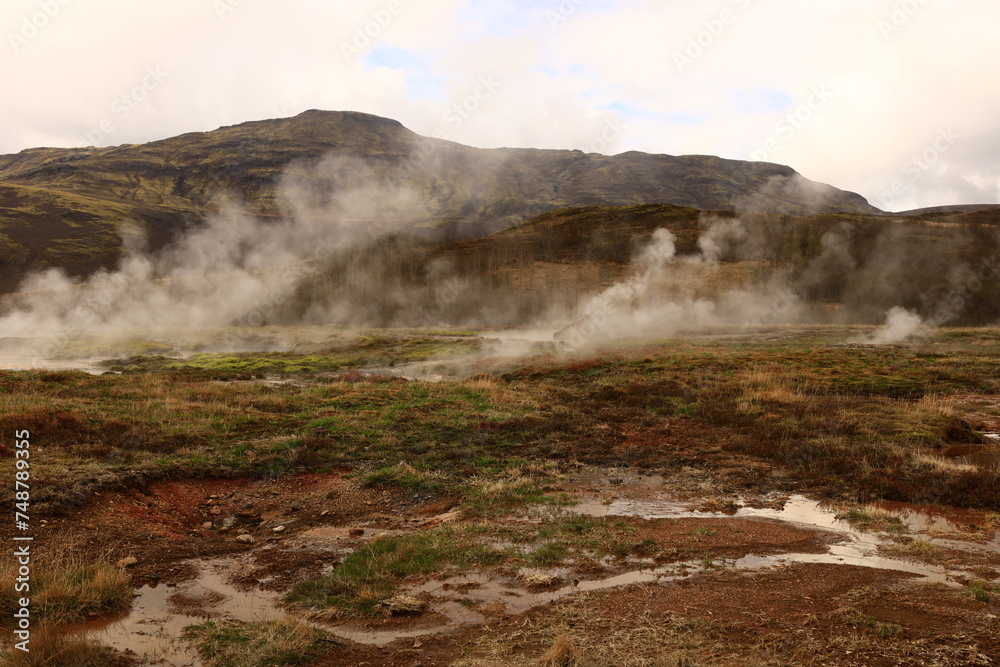 The Geysir geothermal field is a collection of hot springs, a dome and a volcanic cone that make up the remains of an ancient volcano in Iceland. The Geysir geothermal field is a collection of hot springs, a dome and a volcanic cone that make up the remains of an ancient volcano in Iceland.
