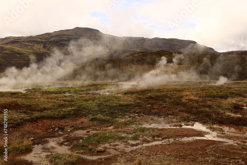 The Geysir geothermal field is a collection of hot springs, a dome and a volcanic cone that make up the remains of an ancient volcano in Iceland. © marieagns