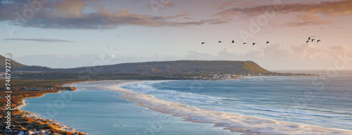 Foto Water, drone and beach sunset with peace, beauty and location tranquility in nature
