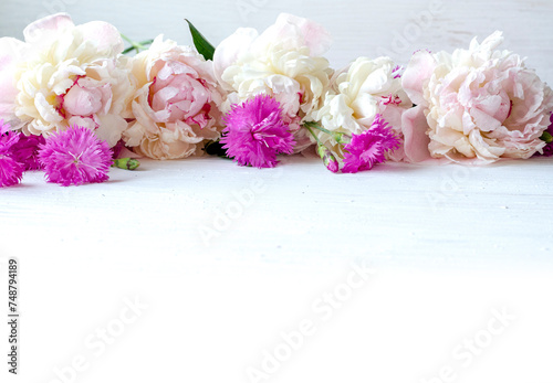 Beautiful background with peonies and field carnations for your design. Floral wallpaper and blank, template.