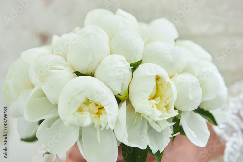 Fototapeta Naklejka Na Ścianę i Meble -  A composition of flowers from a florist. Decoration of an event or holiday. Wedding bouquet in the hands of the bride