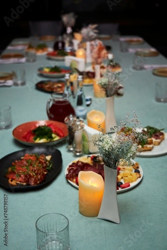 Table decoration in the form of vases and candles.