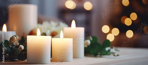 A collection of white candles arranged neatly on top of a wooden table  creating a simple yet elegant display. The candles are unlit and sit side by side  casting a soft glow in the room.