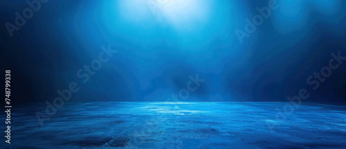 Deep blue gradient background with spotlight effect, product showcase or dramatic portrait photo