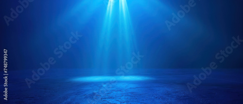 Deep blue gradient background with spotlight effect, product showcase or dramatic portrait