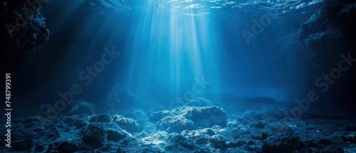 Underwater scene with blue spotlight from above, simulating ocean depths, mysterious ambiance photo