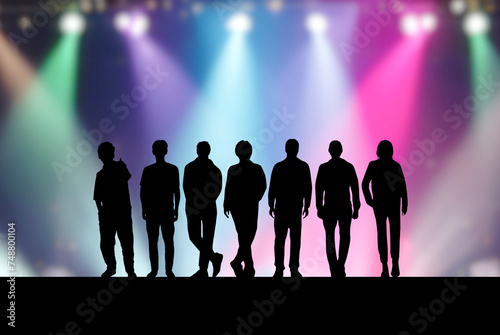 ステージ上の7人の男性アイドルとカラフルなスポットライト photo