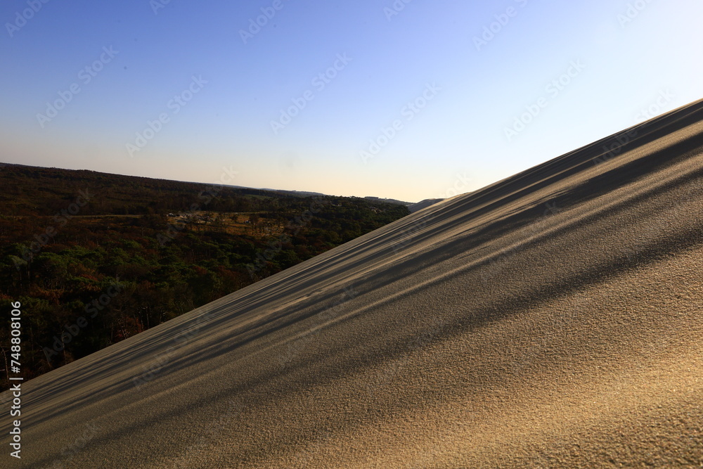 Naklejka premium The Dune of Pilat is the tallest sand dune in Europe. It is located in La Teste-de-Buch in the Arcachon Bay area, France