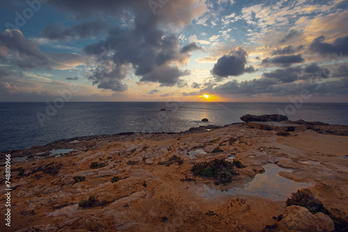 Fantastic sunset exposure views of rocky coast famous Dwejra rocks , Gozo island, Malta