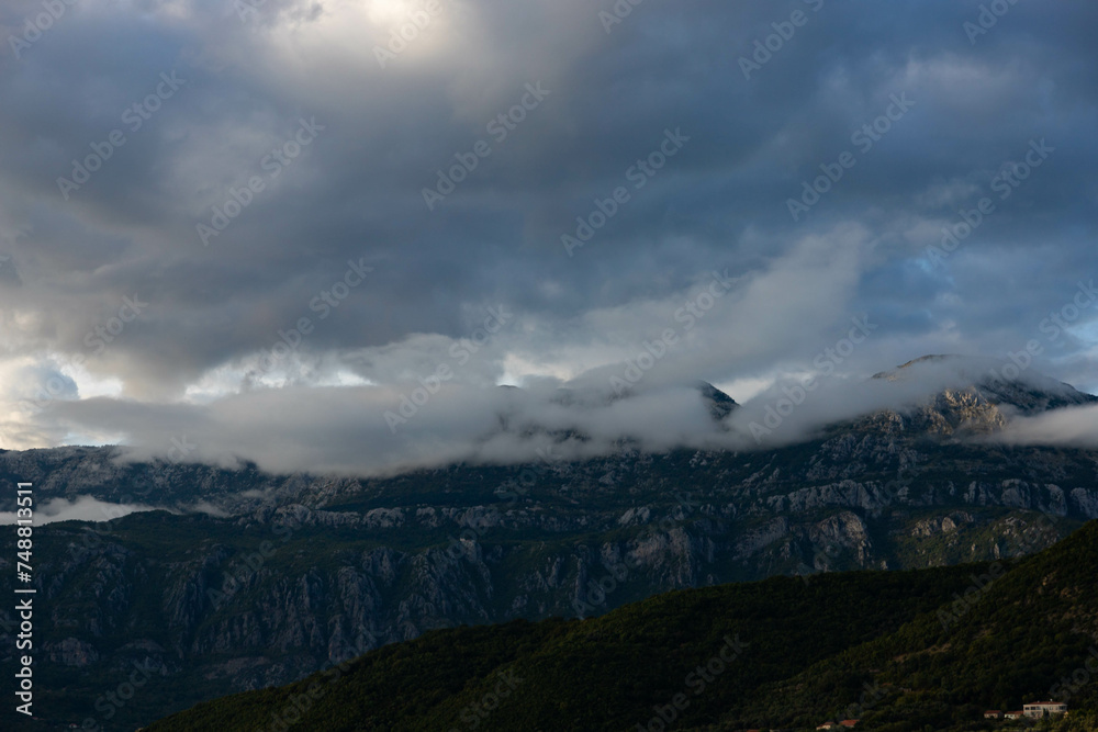 Mountain landscape on a sunny day. Montenegro, Dinaric Alps, view of the peaks of Mount Lovcen. Mountain landscape on a sunny day. Montenegro, Dinaric Alps, view of the peaks of Mount Lovcen.