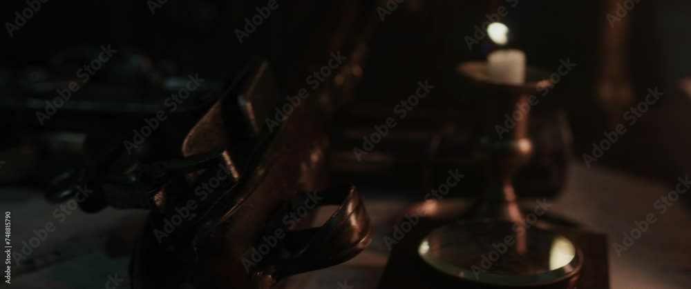 A wind blows off a candle inside the old pirate sailing ship cabin A wind blows off a candle inside the old pirate sailing ship cabin