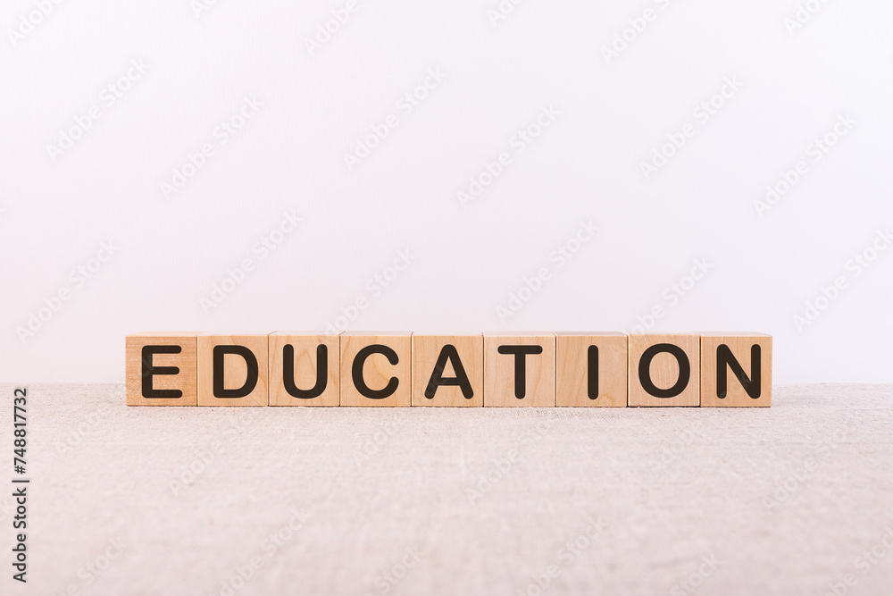 Fototapeta premium Education word concept written on a light table and light background