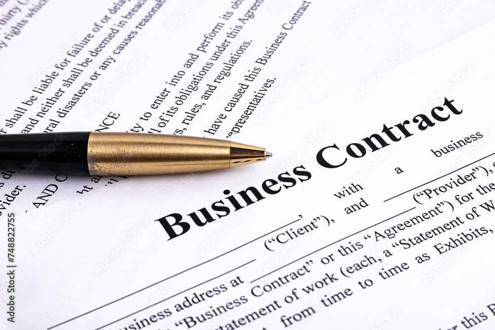 The pen lies on the contract. Business relationship concept. The pen lies on the contract. Business relationship concept.