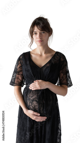 photo of a pregnant woman touching her belly/stomach in black net dress