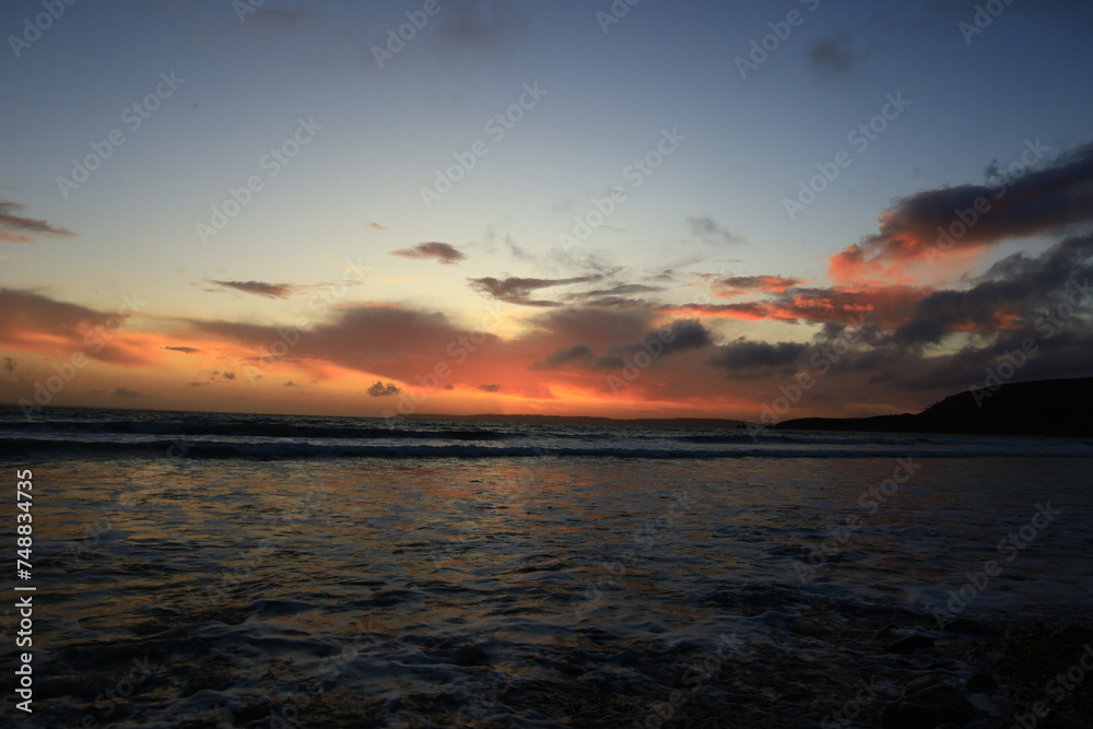 View on a sunset on the Pentrez beach located in the department of Finistère, in the region of Brittany View on a sunset on the Pentrez beach located in the department of Finistère, in the region of Brittany